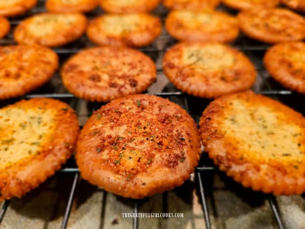 The garlic Parmesan Ritz bites cool to room temperature on a wire rack.