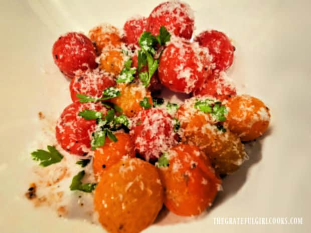 Garnished with grated Parmesan and fresh parsley, the grilled cherry tomatoes are served.
