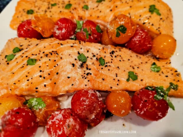 Grilled Plank Salmon and Tomatoes are served on a large platter.