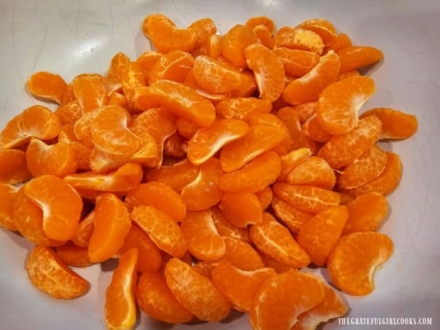 Mandarin oranges are peeled, and white "pith" areas are removed before canning.