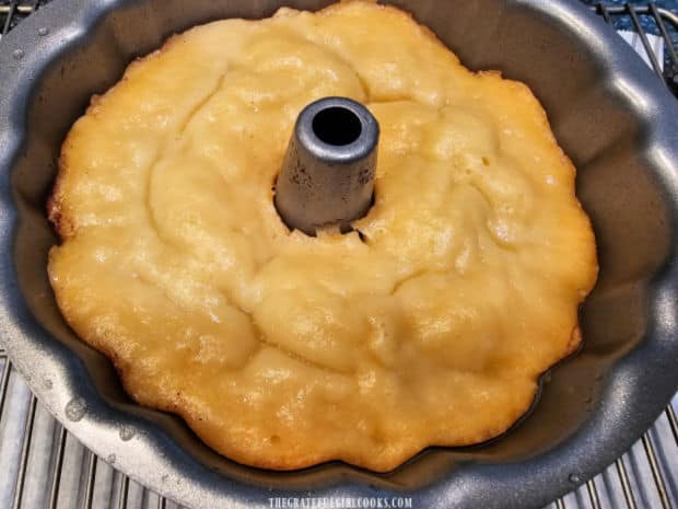 The cooked bundt cake cools in the pan for 5 minutes, then is removed from the pan.