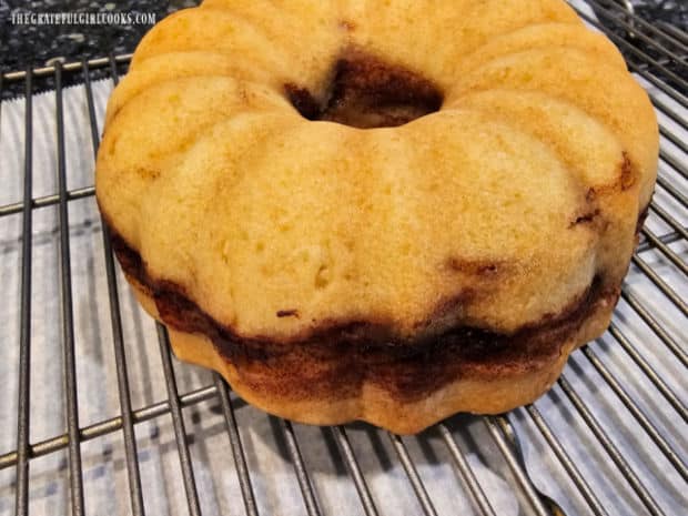 After inverting pan to remove cake, it is turned right side up and cools on wire rack.