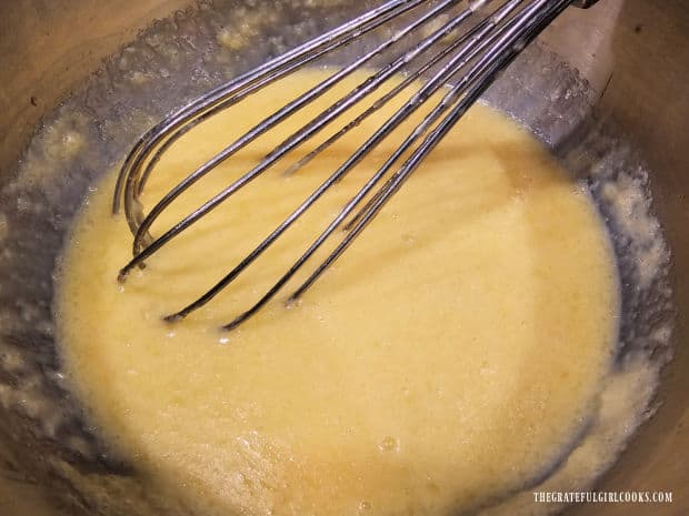 Wet ingredients for the bundt cake batter are whisked to combine.
