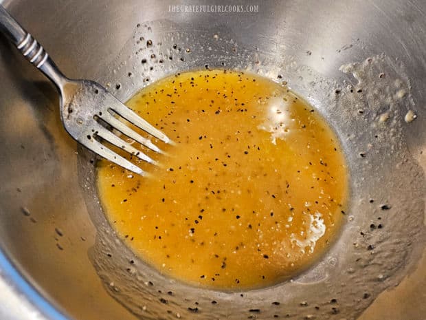 A lemon Dijon salad dressing ix mixed together for the salad.