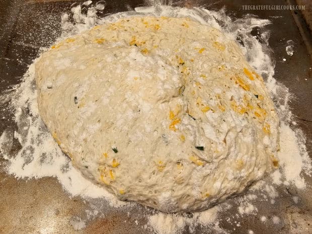 Cheddar Chive No-Knead Bread - The Grateful Girl Cooks! Round loaf is shaped and extra flour is used to make it non-sticky.