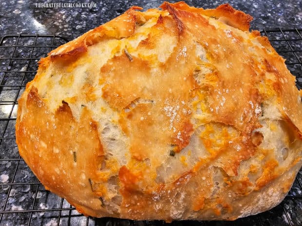 Cheddar Chive No-Knead Bread - The Grateful Girl Cooks! The no-knead bread cools slightly on wire rack before being sliced.
