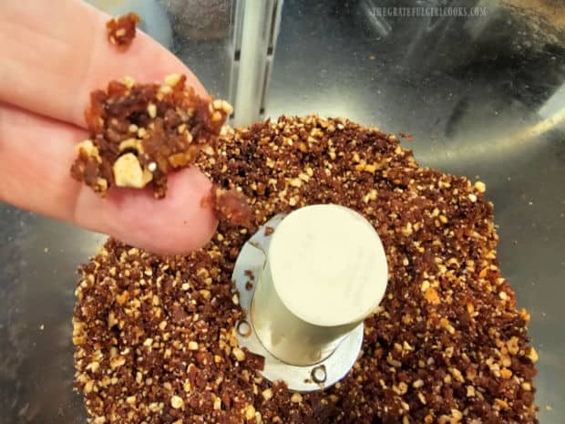 Pressing the date and nut mixture with fingers indicates if it will hold together firmly or not.