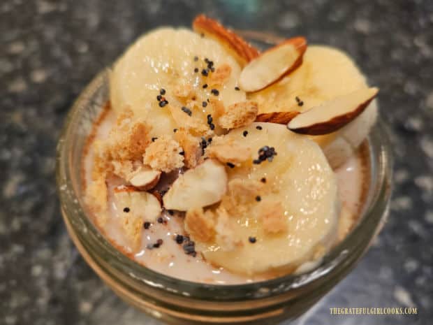 Creamy banana pie overnight oats, topped with banana slices, graham cracker crumbs and almonds.