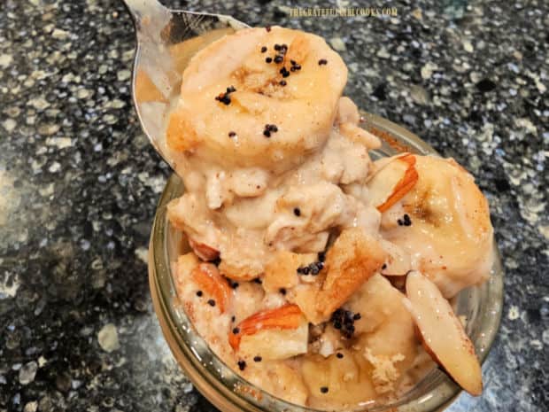 A spoonful of the overnight oats reveals the creamy cold oats, ready to be eaten.