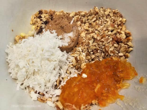 The ingredients for crunchy oatmeal marmalade bars are measured into a large mixing bowl.