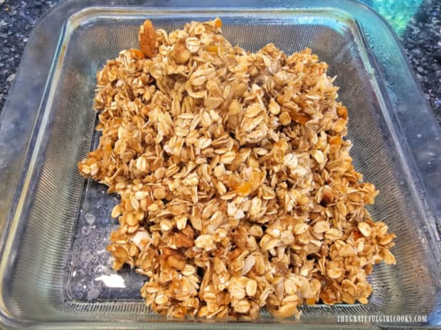 The mixture for the oatmeal bars is poured into a greased baking dish.