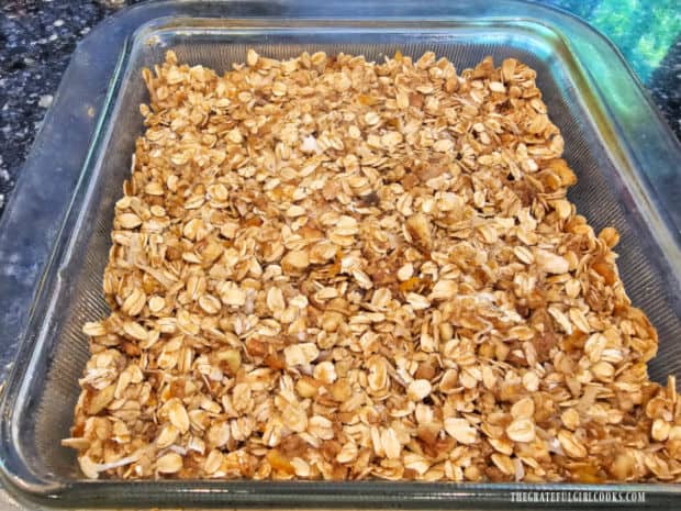 All of the oat mixture is pressed firmly down into the greased baking dish.