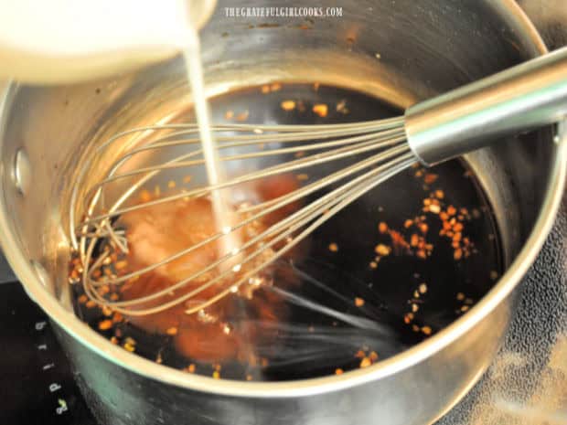 Homemade Teriyaki Glaze - The Grateful Girl Cooks! The cornstarch mixture is whisked into the teriyaki glaze in the pan.