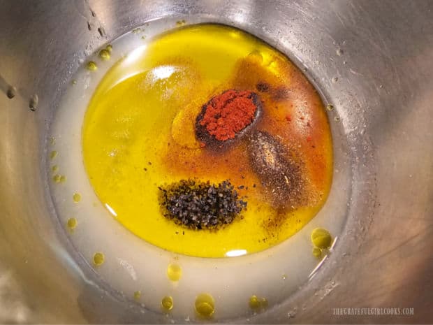 Olive oil, lemon juice, honey and spices are combined to make a salad dressing.