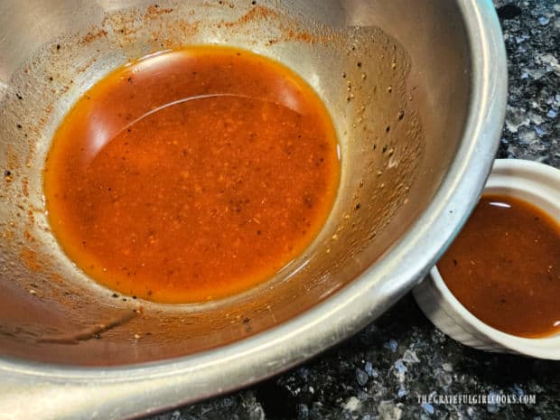 Salad dressing is divided into two portions for two different uses.