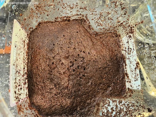 Thai Iced Coffee - The Grateful Girl Cooks! Coffee grounds are strained into a large container.