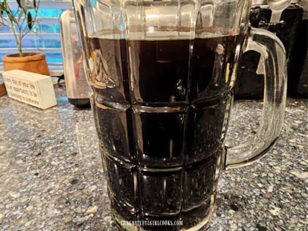 Thai Iced Coffee - The Grateful Girl Cooks! A pitcher full of really strong coffee after straining is complete.
