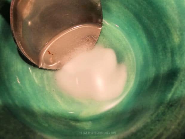 Baking soda is dissolved into boiling water, then added to browned butter mixture.