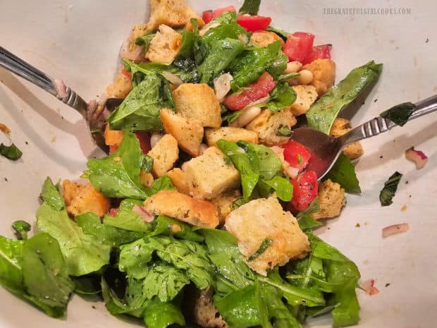 Crisp homemade croutons are tossed into the panzanella salad before serving.