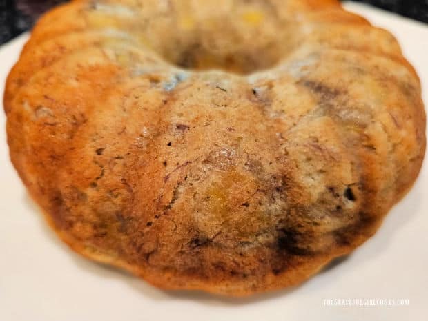 Air Fryer Banana Pecan Cake - The Grateful Girl Cooks! Air Fryer Banana Pecan Cake is served on a white plate after it has cooled a bit.