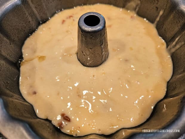 Air Fryer Banana Pecan Cake - The Grateful Girl Cooks! the batter is poured evenly into the prepared bundt pan.