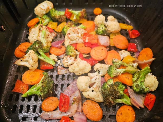 When done, air fryer veggies for two are lightly browned and fork-tender.
