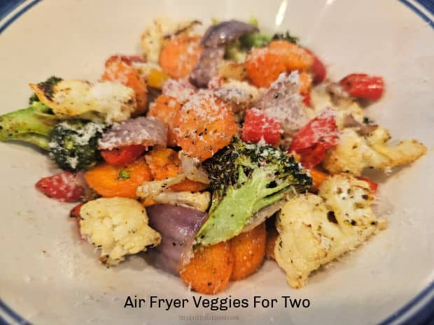 Air Fryer Veggies For Two is a simple dish with seasoned fresh veggies, cooked till lightly browned and tender, topped with Parmesan cheese.