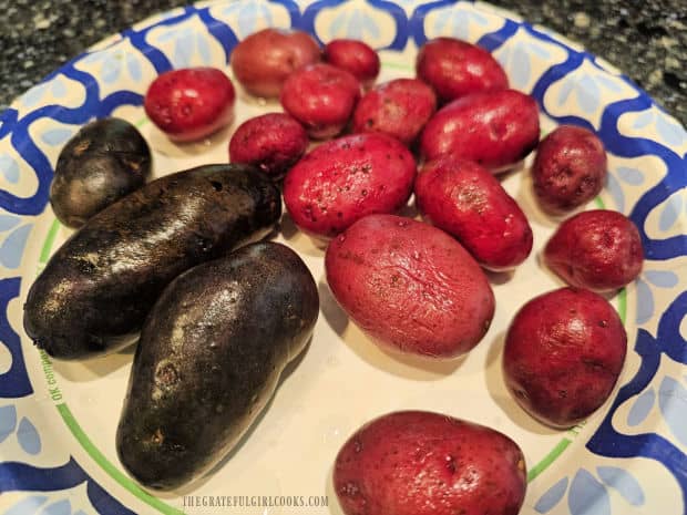 Red potatoes are rinsed well before boiling them in water.