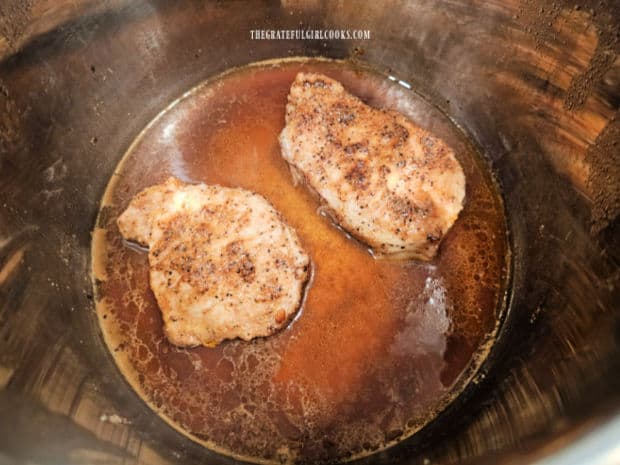 Fully cooked pork chops rest for 5 minutes after pressure cooking (and before serving).