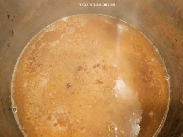 Instant Pot is deglazed with chicken broth, then Worcestershire and Liquid Smoke is added.