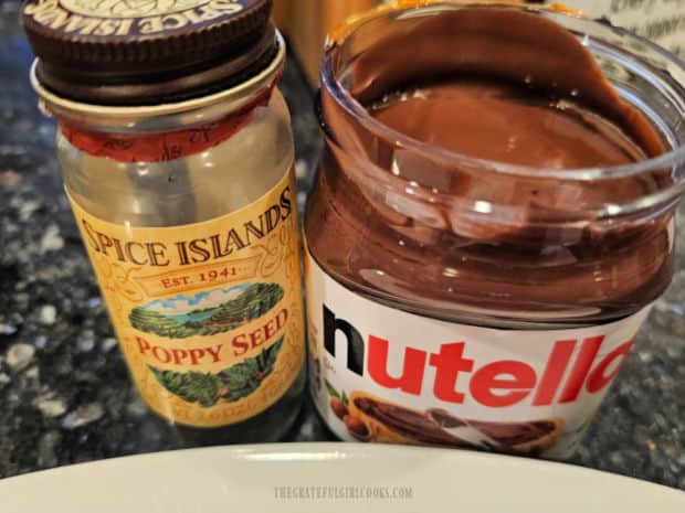 Nutella hazelnut spread and poppy seeds are also used to top the waffles.