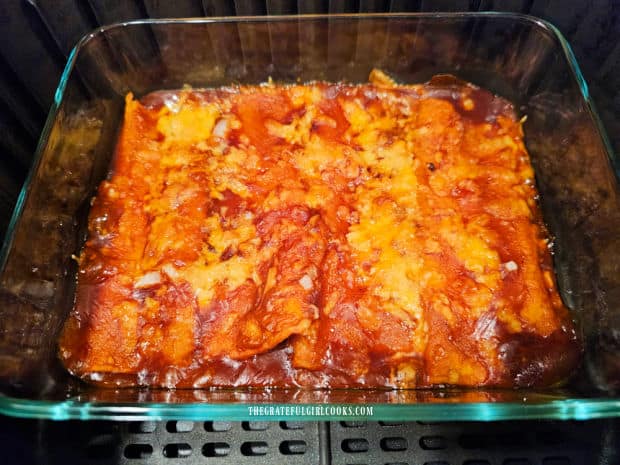 Air Fryer Cheese Enchiladas - The Grateful Girl Cooks! Sauce is bubbly and cheese is melted on the enchiladas after cooking.