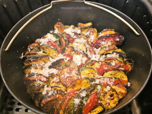 Finely grated Parmesan cheese is sprinkled on top of the air fryer ratatouille.