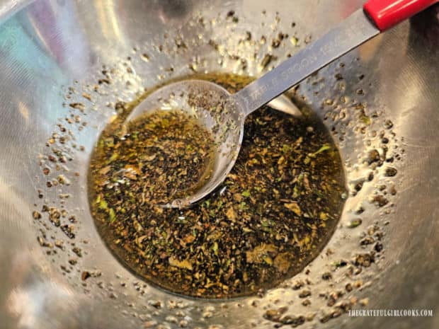 Spice mixture is made with olive oil, salt, pepper, oregano and basil.