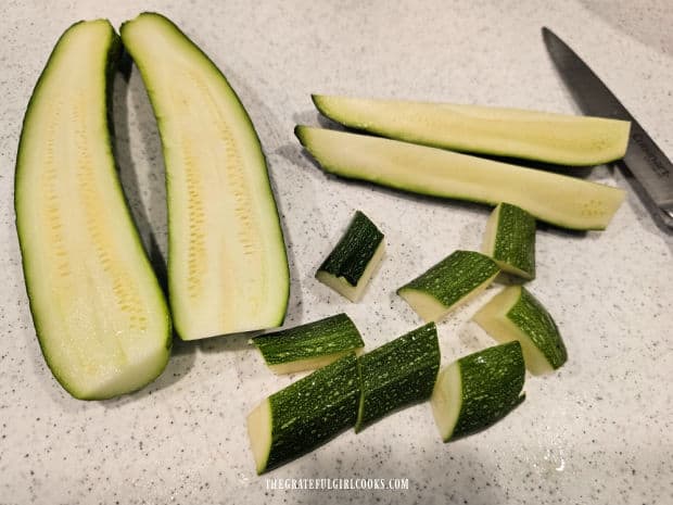 Air Fryer Zucchini Bites (For Two) - The Grateful Girl Cooks! Each zucchini is sliced lengthwise, then again, then cut into bite-sized pieces.