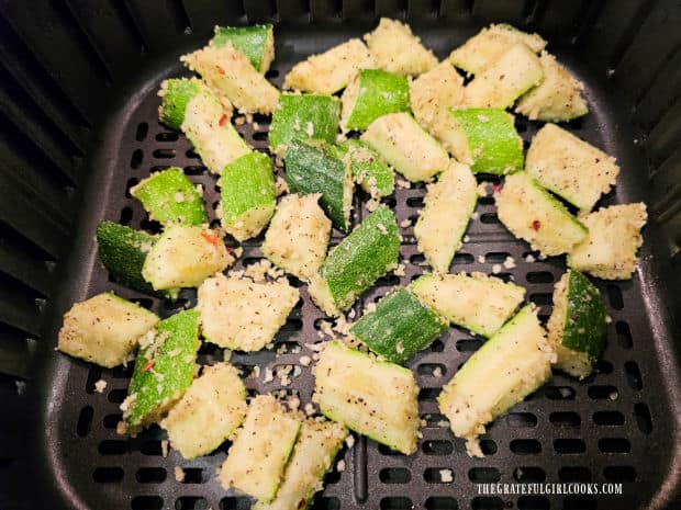 Air Fryer Zucchini Bites (For Two) - The Grateful Girl Cooks! Panko-coated zucchini bites are placed in air fryer basket in a single layer for cooking.
