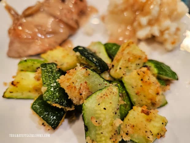 Air Fryer Zucchini Bites (For Two) - The Grateful Girl Cooks! Air Fryer Zucchini Bites For Two, served on plate with pork and mashed potatoes.