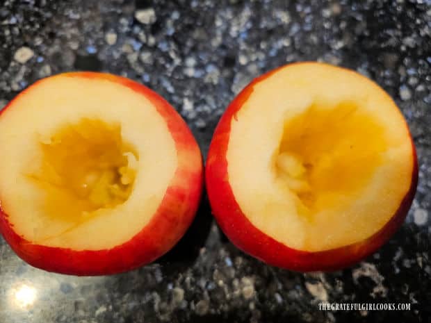 A wider circle is carved out of the apples to hold the streusel filling.
