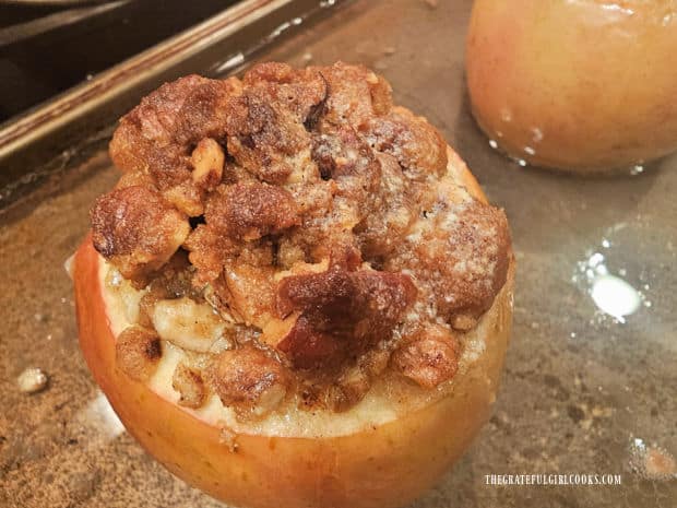 Baked apples for two are browned and very tender once they are finished cooking.