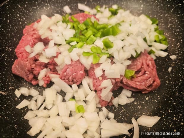 Ground beef, onions and green peppers in a large skillet.