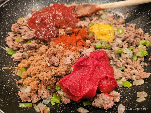 Remaining sauce ingredients are added to the ground beef mixture in skillet.