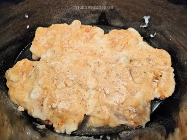 Cream of mushroom soup and ranch dressing mix on top of the pork chops.