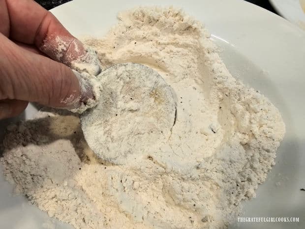 Step 1 is to dredge each eggplant slice in a seasoned flour mixture.