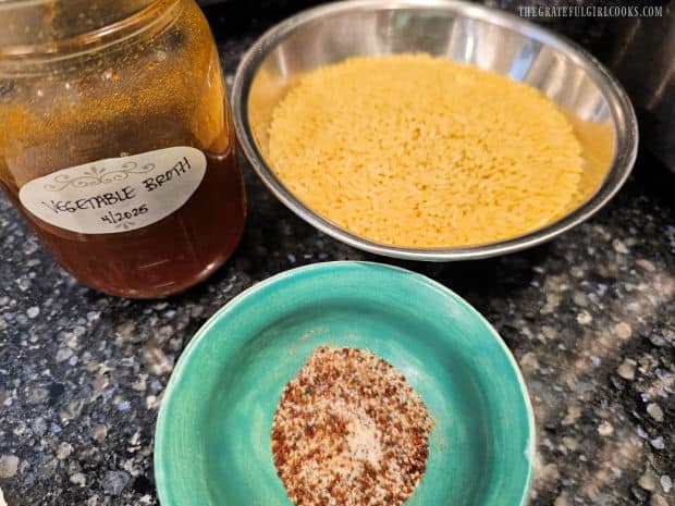Crockpot Cheesy Enchilada Orzo - The Grateful Girl Cooks! Dried orzo, spice mix and remaining vegetable broth to be added later to the crockpot.