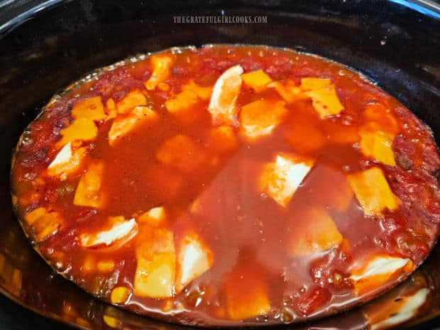 Crockpot Cheesy Enchilada Orzo - The Grateful Girl Cooks! When done cooking, the cream cheese and cheddar cheese are stirred into the hot mixture.
