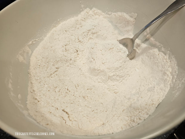 Flour, baking powder and salt are sifted three times into a large mixing bowl.