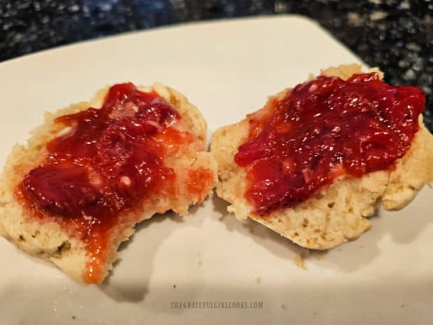 Jam is spread on a biscuit made with homemade Bisquick substitute.
