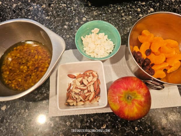 Kimberly's Festive Salad - The Grateful Girl Cooks! Mandarin oranges, dried cranberries, almonds, apple, feta and salad dressing for the salad.