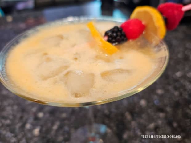 A fruit garnish is served on the peach lemonade spritzer.