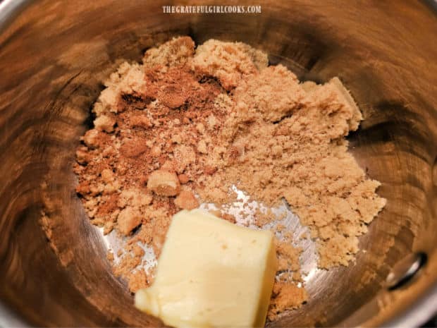 Brown sugar, pumpkin pie spice and butter are combined in a saucepan.